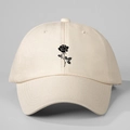Front view of a beige baseball cap with a black rose print on high-quality cotton fabric - One Size / Beige