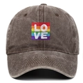 Close-up view of the rainbow LOVE embroidery on a distressed brown washed cotton baseball cap - One Size / Coffee