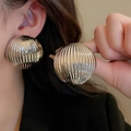 Close-up of oversized silver textured round earrings with vertical ridge details - 85# Silver Needle-Silver-Striped Textured Large Earring