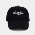 Detail of white Babygirl gothic embroidery on black cotton baseball cap fabric - Black