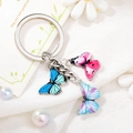 Colorful butterfly alloy keychain with pink and blue enamel pendants on white fabric - Style 9 M747 (Three-color Mix Butterfly)
