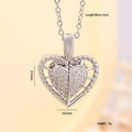 Silver-toned heart necklace with pavé cubic zirconia and an opening wing pendant - Center Zircon Hollow Heart / Silver