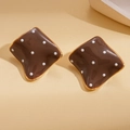 Detailed macro of brown enamel rhombus earrings with white polka dots and gold borders - 925 Silver Needle / Brown