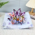 3D pop-up greeting card featuring vibrant butterflies and flowers with purple accents - Blue Big Butterfly