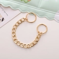 Detailed view of a gold chunky metal chain charm accessory on a pastel background - Gold Metal Flat Chain