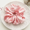 Elegant large pink satin scrunchie with silky finish on a decorative white plate - Large Cherry Pink