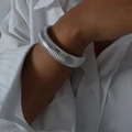 Silver wide ribbed tube bangle bracelet in titanium steel shown on female model's wrist - Bracelet-1.6cm / Steel