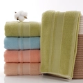 Soft cotton towel set in green, blue, and pink colors with absorbent terry texture - Green Grid Towel