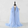 Detail of light blue wrinkled cotton linen scarf with soft texture and frayed edges - Violet Blue