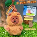 Cute brown capybara plush keychain with metal ring and small bell on grass background - Mini Plush Doll