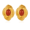 Detailed view of gold steel earrings with oval red stone in a shell swirl design - Red