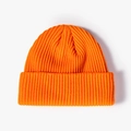 Classic orange ribbed knit beanie for winter featuring a stylish fold-over cuff design - One Size / Orange