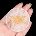 Hand holding white crystal disk with golden triple moon and pentagram tree of life symbols - White Crystal Triple Moon
