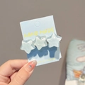 Light blue frosted star hair clip set on display card with 6cm length dimension - Three Stars Hair Clip