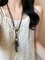 Close-up of star and feather charms on a retro leather tassel necklace for women - 34# Necklace Silver Bohemian Feather