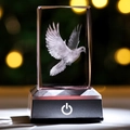 Detail of 3D laser engraved pigeon inside transparent crystal cuboid with glowing base - Peace Dove / 5x5x8CM