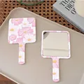 Pink and white floral hand-held makeup mirror with square glass and ergonomic handle - 11 Full Moon Bloom