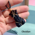 Handcrafted black obsidian goddess torso pendant wrapped in gold wire on a black cord - Obsidian/Metal