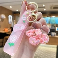 Pink liquid sand flower keychain with transparent floral charm and pink silicone strap - Pink Flower - Flower Shape
