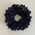 Chic black lace scrunchie with intricate floral eyelets and scalloped wavy edge design - Black Lace Scrunchie