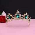 Detailed shot of Baroque golden crown with green teardrop gems and white rhinestones - No.11 KC Gold (Green Stone)