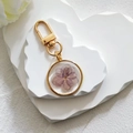 Golden keychain with a heart-shaped stand featuring a purple dried flower pendant - Purple Multi-layer Flower