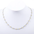 Detailed view of interconnected white daisy petals and 18K silver plated chain - Steel + White Stone