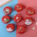 Christmas round tinplate coin purse featuring Santa and reindeer with red hanging rope - Round Christmas A