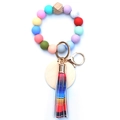 Silicone beaded keychain bracelet with wood beads, leather tassel and gold metal ring - Rainbow