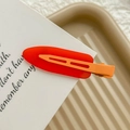 Rainbow-colored seamless hair clip featuring a red translucent base and orange matte finish - Neon Orange