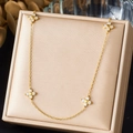 Elegant gold necklace with four-petal diamond flower pendants on a premium satin display - Symmetrical Four Floral Zirconia Simple Style (N4104)