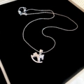 Detail of silver rocking horse necklace with crystal accent on black velvet base - Silver Ball Chain Rhinestone Swinging Horse Necklace (14#)