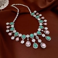Detailed macro view of silver water-drop necklace with green and pink stones - 24# Necklace-Silver-Blue-Pink
