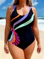 Detail of plus size one piece swimsuit featuring vibrant side panels and sunlit beach scene - Black Background Multi-color Stripes
