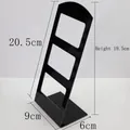 L-shaped black acrylic earring display stand with multi-hole design for jewelry storage - Black