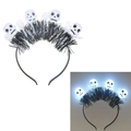 Detail of Halloween LED headband featuring white skulls and black tinsel with glowing effect - Skull Tinsel Headband