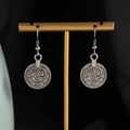 Bohemian silver coin drop earrings with vintage embossed textures on a golden display stand - Antique Silver Earrings (S3323-2)