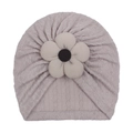 Detail of baby turban hat featuring purple cable knit texture and 3D floral accent - Gray