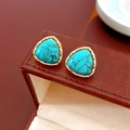 Detail of vintage turquoise triangle stud earrings with gold metal frame on leather - 16# Silver Pin Triangle Faux Stone Studs