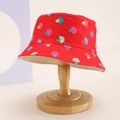 Close-up of a red kids bucket hat with colorful cartoon mushroom prints on a wooden stand - Kids One Size / Red (Mushroom)