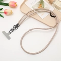 Detail of beige braided phone lanyard with dark metal hooks and grey attachment pad - Khaki
