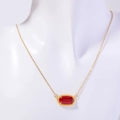 Gold birthstone necklace with a rectangular red crystal pendant on a white bust - January Necklace