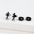 Detailed close-up of matte black ballet dancer silhouette earrings on a white stone base - 132 Ballerina / Black
