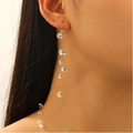 Detailed close-up of long beaded tassel earrings featuring clear crystal-like facets - White K0429