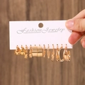 Golden earrings set featuring six pairs of textured hoops and polished metal rings - KC Gold (4300)
