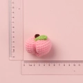Handmade crochet pink peach keychain with green leaf and size measurement guide - Pink Yarn Peach