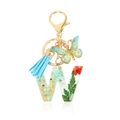 Letter W resin keychain with real green dried flowers and a light blue tassel - Letter W