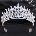 Detailed view of baroque silver crown featuring light blue rhinestones and hair combs - Silver Blue Crystal