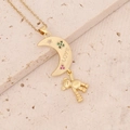 Close-up of a gold necklace with a moon and bear pendant featuring LOVE engraving - Moon Bear LOVE