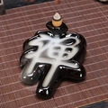 Black ceramic backflow incense burner in Zen character design with white smoke flow - Zen